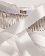 Satin Bow Hair Comb featuring a white satin ribbon, metal hair comb, and a small gold HONOR label displayed on a light background.
