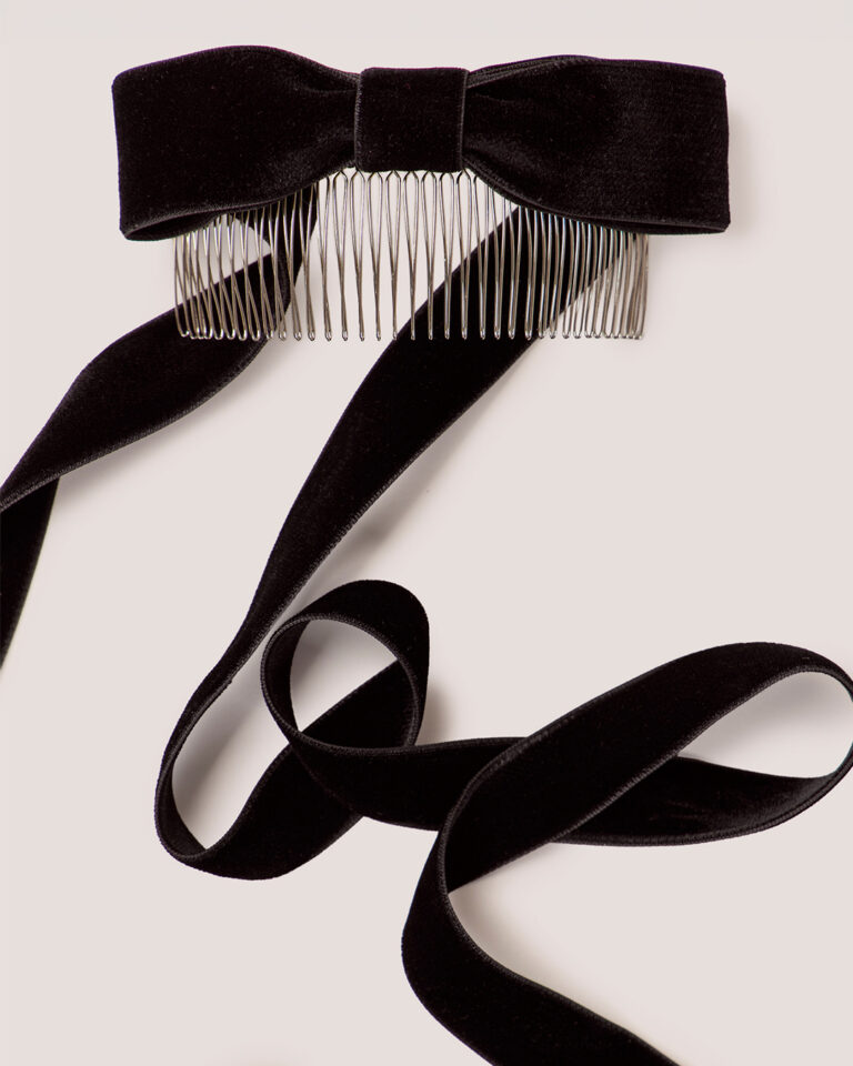 Velvet Bow Hair Comb featuring long black ribbon tails, displayed on a light background.
