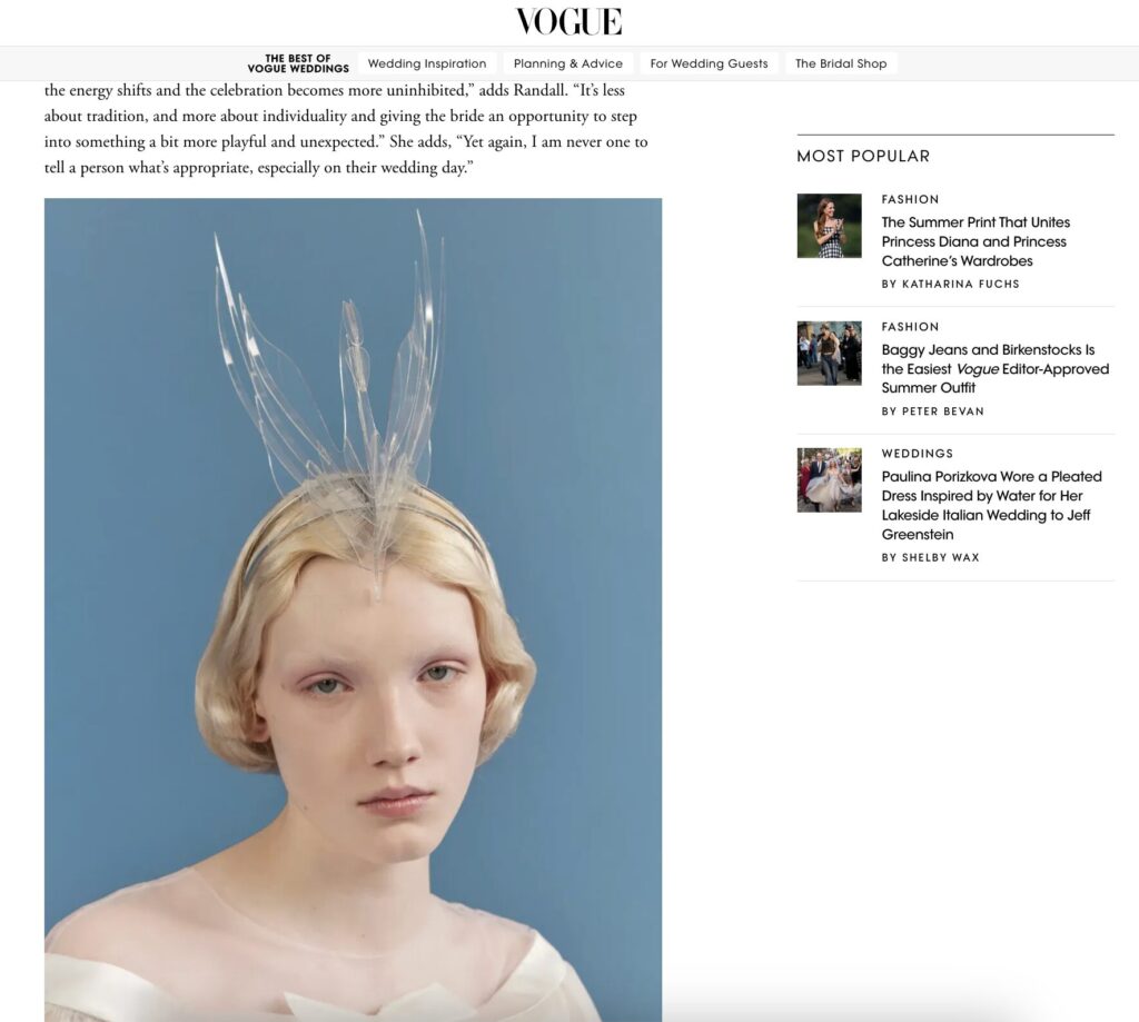 Woman with short blonde hair wears a sheer dress and a swan headpiece against a soft blue background, as shown in Vogue's "Best of Weddings."